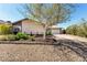 Charming home with desert landscaping, an extended driveway, and a two-car garage at 432 Bottle Brush Way, Henderson, NV 89015