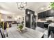 Open concept kitchen features stainless steel appliances and dark wood cabinetry at 432 Bottle Brush Way, Henderson, NV 89015
