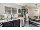 Kitchen area showcases granite countertops, stainless appliances, and casual dining at 432 Bottle Brush Way, Henderson, NV 89015