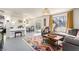 Bright and airy living room with a decorative rug, ample seating, dining area and great natural lighting at 432 Bottle Brush Way, Henderson, NV 89015