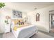 Bright main bedroom with horse artwork, decorative pillows, and bedside tables at 432 Bottle Brush Way, Henderson, NV 89015
