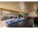 Cozy covered back patio with spa, outdoor seating area, and low maintenance landscaping at 455 Paulson Dr, Las Vegas, NV 89123