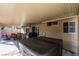 Covered patio with outdoor dining table, barbecue, and hot tub at 455 Paulson Dr, Las Vegas, NV 89123