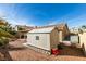 The backyard features a storage shed next to the home's covered patio at 455 Paulson Dr, Las Vegas, NV 89123