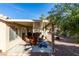 Relaxing backyard featuring a covered patio with outdoor seating at 455 Paulson Dr, Las Vegas, NV 89123