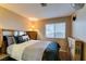 Bedroom features a queen-sized bed, and natural light from the window at 455 Paulson Dr, Las Vegas, NV 89123