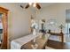 Open dining area with modern table, chairs, decorative cabinet, and access to the kitchen at 455 Paulson Dr, Las Vegas, NV 89123