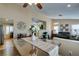 Inviting dining area with stylish decor, seamlessly connected to the living room for easy entertaining at 455 Paulson Dr, Las Vegas, NV 89123