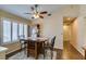 Dining area showcases a ceiling fan, wooden table with seating, and plantation shutters at 455 Paulson Dr, Las Vegas, NV 89123