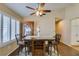 The dining area features stylish seating, cabinet, and ample natural light from the windows at 455 Paulson Dr, Las Vegas, NV 89123