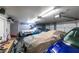 Well-lit garage featuring parking for multiple vehicles, storage, and organization systems at 455 Paulson Dr, Las Vegas, NV 89123