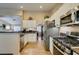 Beautiful kitchen with stainless steel appliances, granite countertops, and ample cabinet space at 455 Paulson Dr, Las Vegas, NV 89123