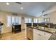 Open kitchen featuring stainless steel appliances, granite countertops, and bright, natural light at 455 Paulson Dr, Las Vegas, NV 89123