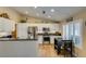 Bright kitchen features stainless steel appliances, granite countertops, and a cozy breakfast bar at 455 Paulson Dr, Las Vegas, NV 89123
