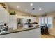 Charming kitchen featuring granite countertops and a convenient breakfast bar for casual dining at 455 Paulson Dr, Las Vegas, NV 89123