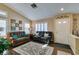 Cozy living room with wood floors, plantation shutters, neutral walls, and comfortable seating at 455 Paulson Dr, Las Vegas, NV 89123