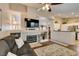 Warm living room with a fireplace, TV, and a view into the kitchen, ideal for Gathering time at 455 Paulson Dr, Las Vegas, NV 89123