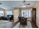 Open living and dining area with natural light, wood floors, and stylish furnishings at 455 Paulson Dr, Las Vegas, NV 89123