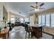 Bright and spacious living area featuring hard wood flooring, ceiling fan and plantation shutters at 455 Paulson Dr, Las Vegas, NV 89123