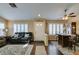 Cozy living room with wood floors, plantation shutters, neutral walls, and comfortable seating at 455 Paulson Dr, Las Vegas, NV 89123