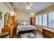Main bedroom features a ceiling fan, window with plantation shutters, and a cozy atmosphere at 455 Paulson Dr, Las Vegas, NV 89123
