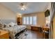 Main bedroom features a ceiling fan, window with plantation shutters, and a cozy atmosphere at 455 Paulson Dr, Las Vegas, NV 89123