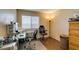 Office space featuring neutral walls, modern desk, and laminate wood flooring at 455 Paulson Dr, Las Vegas, NV 89123