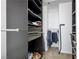 Organized walk-in closet with built-in shelving and ample storage at 4850 Straight Flush Dr # 103, Las Vegas, NV 89122