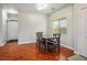 Elegant dining room featuring hardwood floors, neutral paint and contemporary lighting at 4850 Straight Flush Dr # 103, Las Vegas, NV 89122
