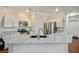 Modern kitchen with stainless steel appliances, granite countertops and white cabinets at 4850 Straight Flush Dr # 103, Las Vegas, NV 89122