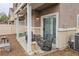 Relaxing covered patio area with outdoor furniture, a ceiling fan, and views of the community at 4850 Straight Flush Dr # 103, Las Vegas, NV 89122