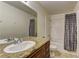Bathroom featuring granite counters, a single sink vanity, toilet, and tub with shower at 5161 Lindell Rd # 201, Las Vegas, NV 89118
