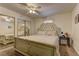 Comfortable bedroom featuring a ceiling fan, mirrored closet doors, and a decorative headboard at 5161 Lindell Rd # 201, Las Vegas, NV 89118