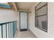 Inviting front porch with a white door, window and green trim at 5161 Lindell Rd # 201, Las Vegas, NV 89118