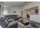 Comfortable living room with a large sectional and a kitchen view at 5161 Lindell Rd # 201, Las Vegas, NV 89118