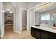 Bathroom with tiled floors features access to both the bedroom and a separated toilet and sink area at 563 Moon Chase St, Las Vegas, NV 89110