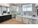 Bathroom features a large soaking tub, tiled floors, and a glass enclosed shower at 563 Moon Chase St, Las Vegas, NV 89110