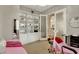 Cozy bedroom or flex space with built-in shelving and storage, and a relaxing massage table at 563 Moon Chase St, Las Vegas, NV 89110