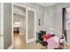 Well-lit bedroom or flex space with built-in shelves and storage, and a comfortable massage table at 563 Moon Chase St, Las Vegas, NV 89110