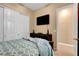 Cozy bedroom features an ensuite bathroom and a mirrored closet at 563 Moon Chase St, Las Vegas, NV 89110