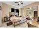A well-lit bedroom with a neutral color palette and a mirrored closet at 563 Moon Chase St, Las Vegas, NV 89110