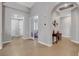 Bright entryway featuring tile flooring, an arched ceiling, and views into other rooms of the house at 563 Moon Chase St, Las Vegas, NV 89110