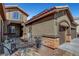 Inviting home featuring stone accents, a tile roof, and a lovely gated courtyard and entry at 563 Moon Chase St, Las Vegas, NV 89110