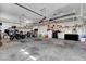 Large two car garage featuring shelving and storage areas at 563 Moon Chase St, Las Vegas, NV 89110