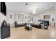 Inviting living room features tile floors, recessed lighting, and built-in bar area at 563 Moon Chase St, Las Vegas, NV 89110
