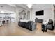 Open-concept living area connects to kitchen, featuring tile flooring and contemporary design at 563 Moon Chase St, Las Vegas, NV 89110