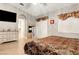 Cozy main bedroom with tile floors, a fireplace, TV, and access to the ensuite bathroom at 563 Moon Chase St, Las Vegas, NV 89110