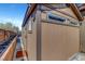 Backyard outbuilding with matching exterior trim and finish, windows, concrete foundation, and access to a paved walkway at 563 Moon Chase St, Las Vegas, NV 89110