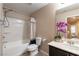Well-appointed bathroom showcasing a shower-tub and a vanity with a dark cabinet at 6255 W Arby Ave # 183, Las Vegas, NV 89118