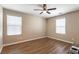 Bright bedroom with wood floors, white blinds, and neutral walls at 6255 W Arby Ave # 183, Las Vegas, NV 89118